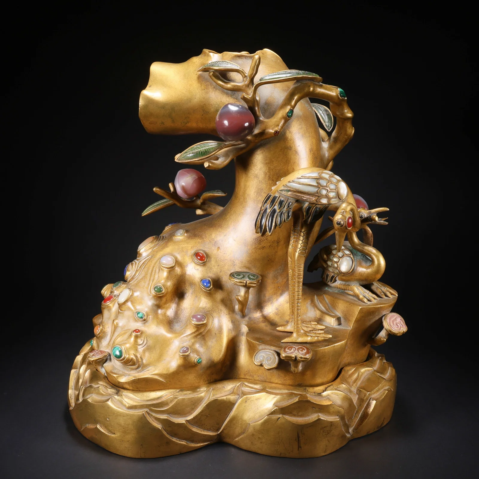 A GILT BRONZE CRANE ORNAMENT WITH INLAID PRECIOUS STONES, SYMBOLIZING LONGEVITY