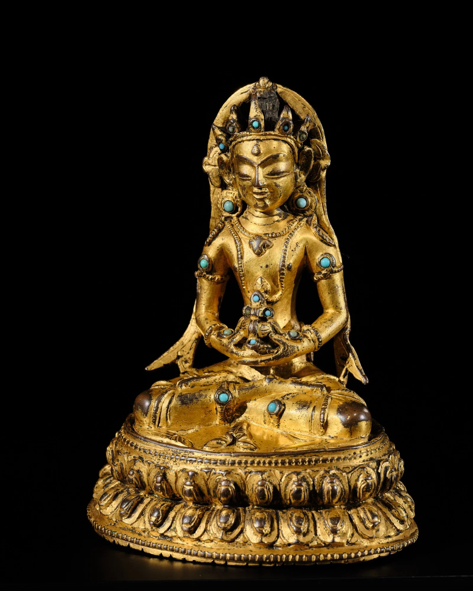 A GILT-BRONZE FIGURE OF AMITAYUS, TIBET, 16TH CENTURY