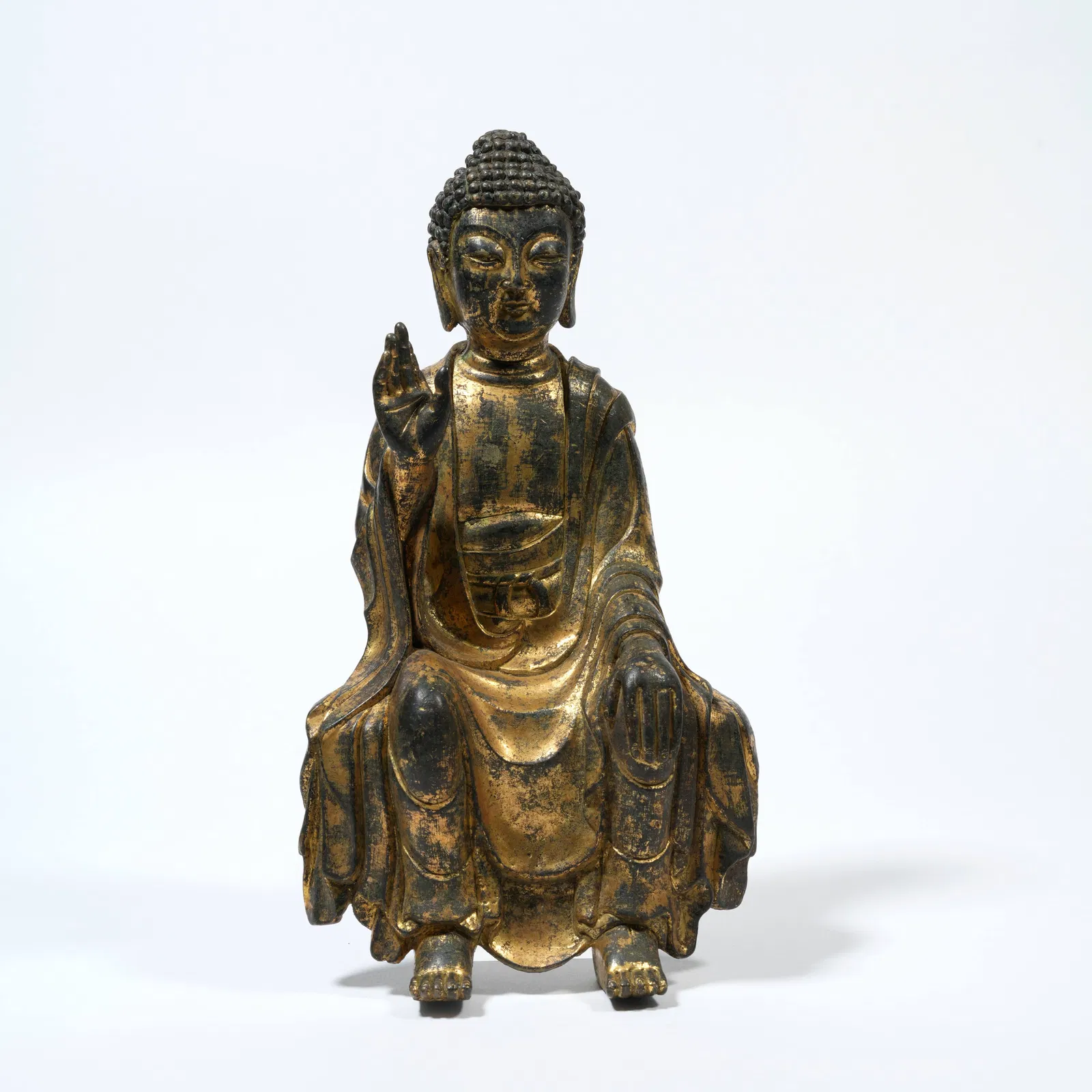 A GILT-BRONZE FIGURE OF SHAKYAMUNI BUDDHA