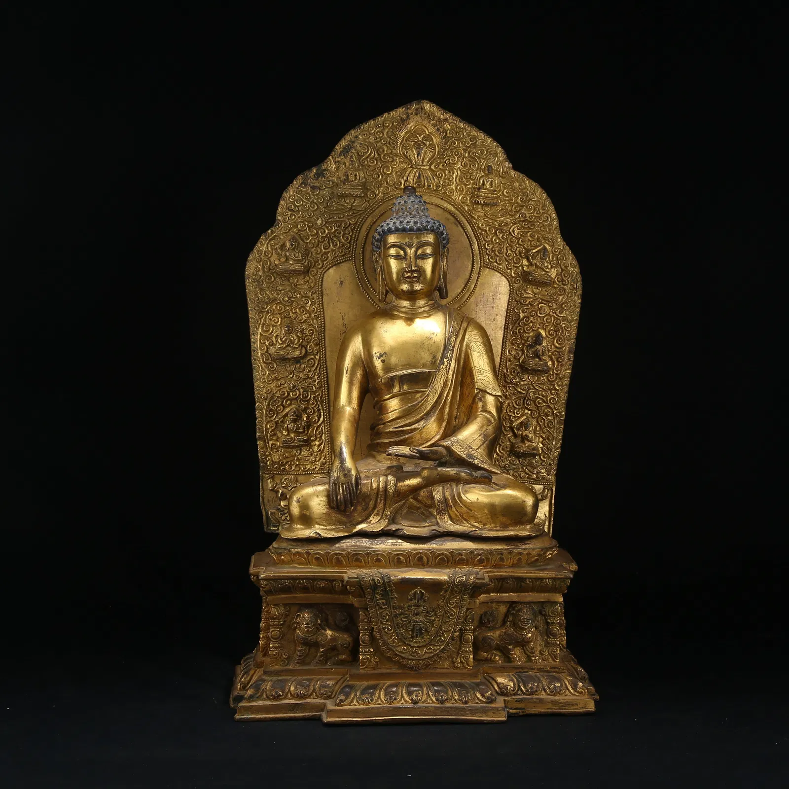 A GILT BRONZE FIGURE OF SHAKYAMUNI BUDDHA