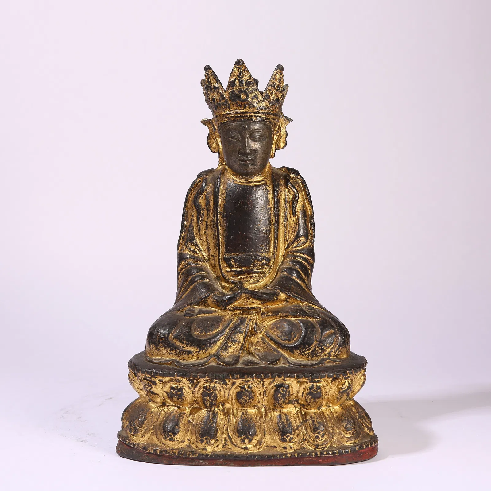 A GILT-BRONZE FIGURE OF VAIROCANA BUDDHA