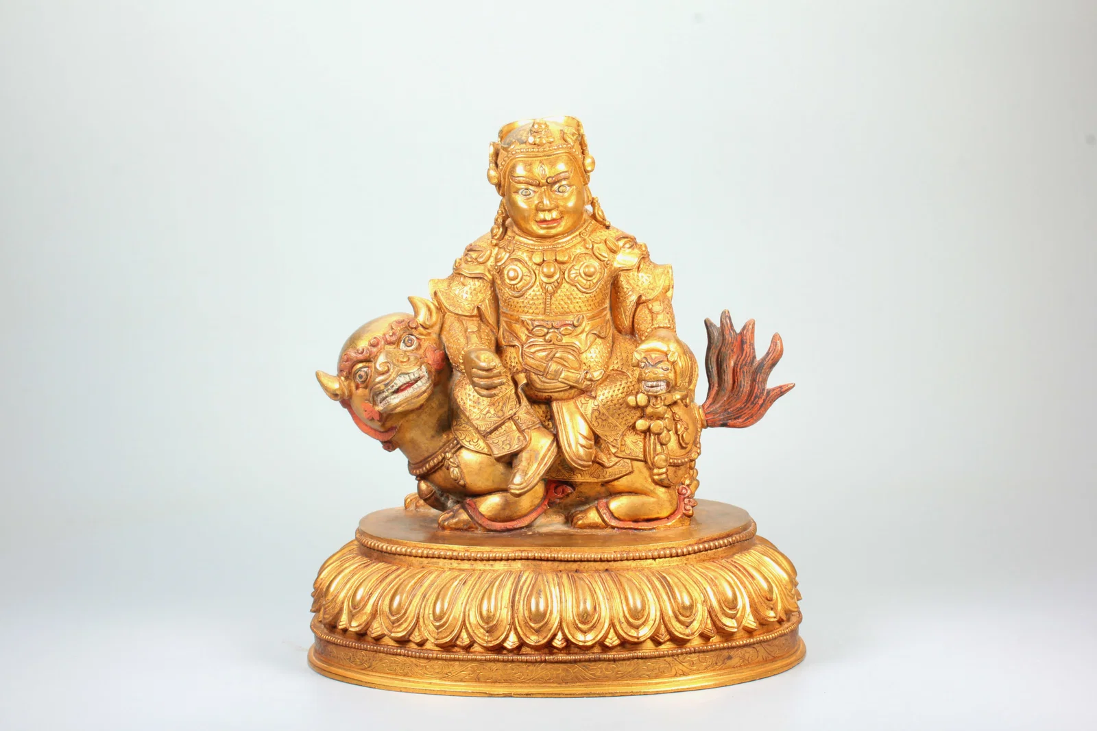 A GILT BRONZE FIGURE OF VAISRAVANA