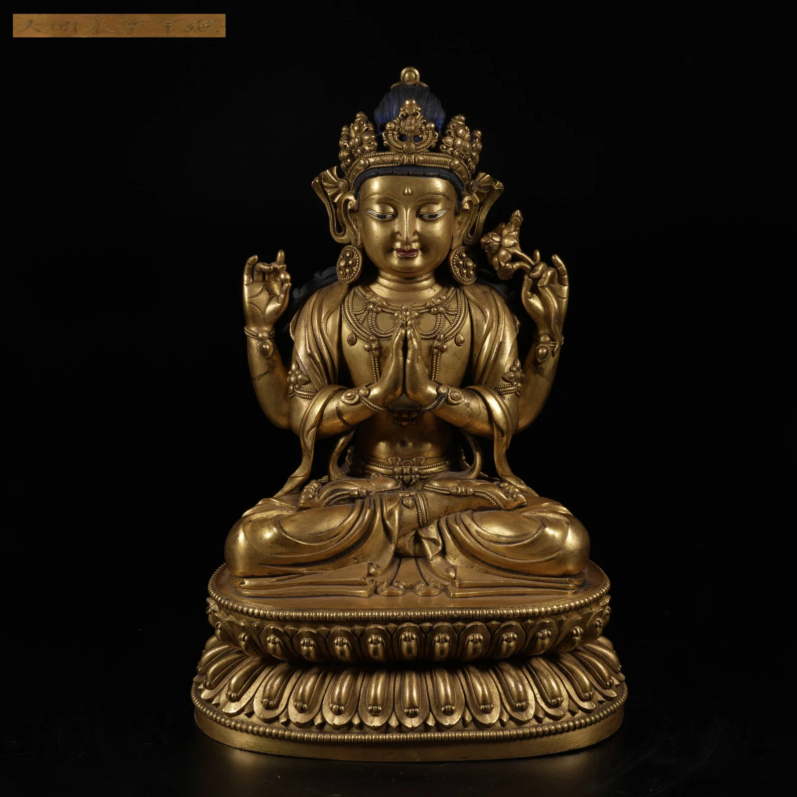 A GILT-BRONZE FOUR-ARMED AVALOKITESHVARA STATUE