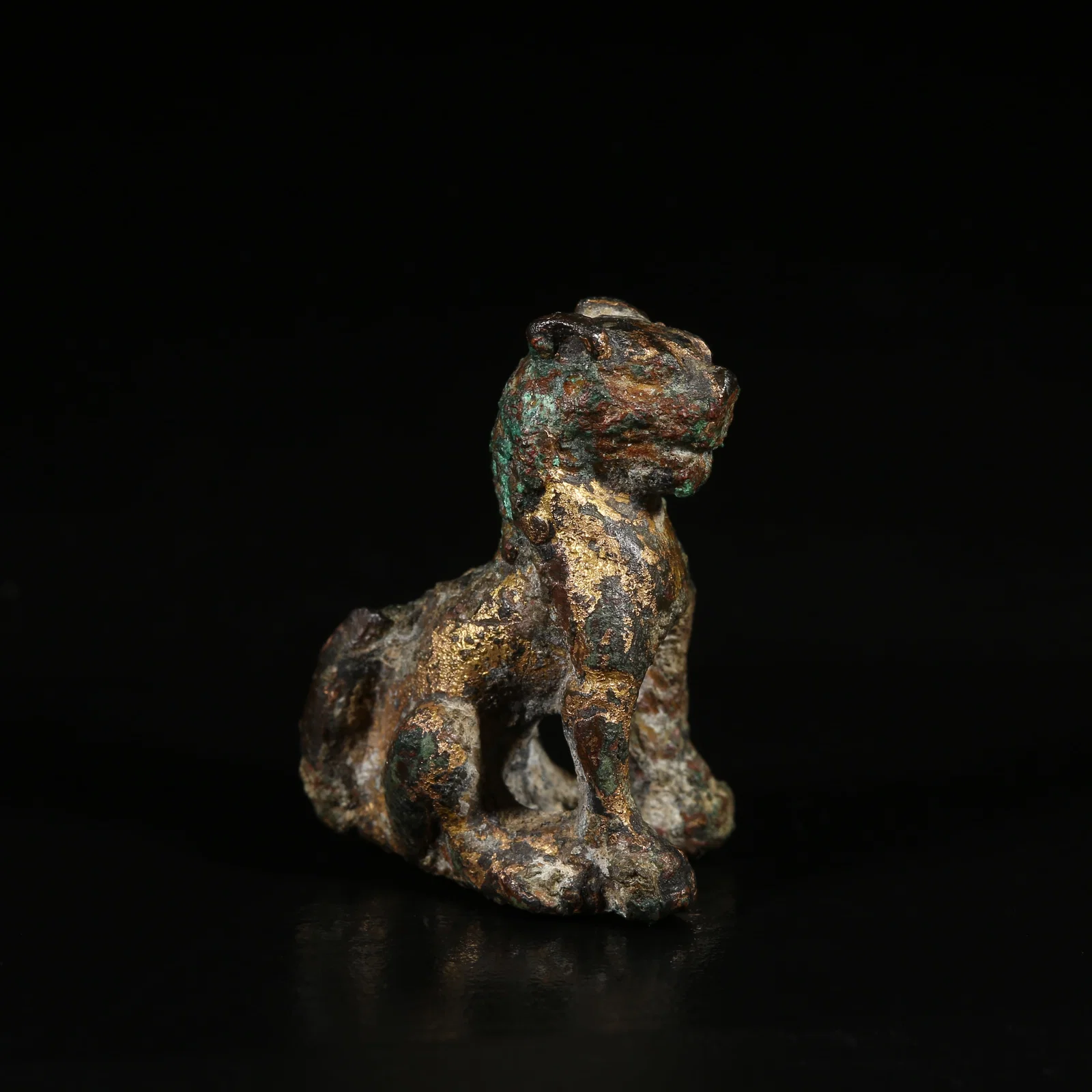 A GILT-BRONZE GUARDIAN LION