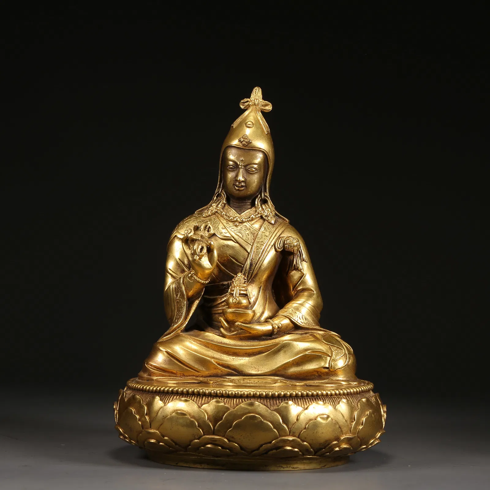 A GILT BRONZE GURU PADMASAMBHAVA STATUE
