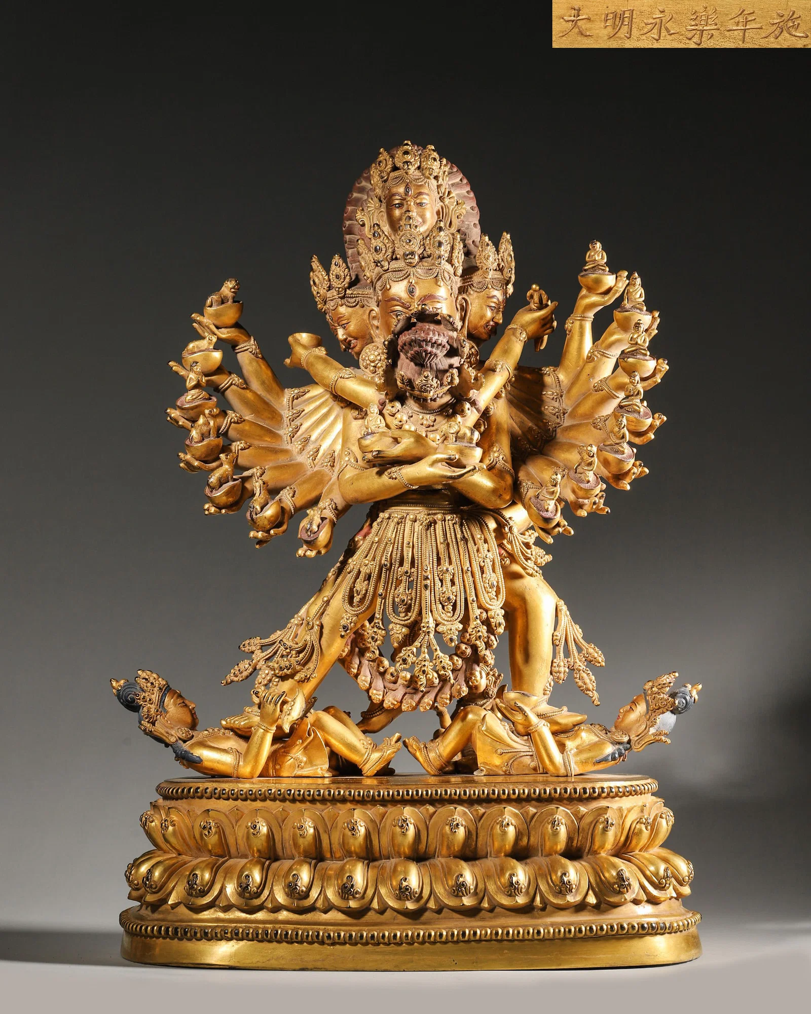 A GILT-BRONZE HEVAJRA (YAB-YUM) STATUE, IMPERIAL PALACE MADE, MING DYNASTY YONGLE PERIOD