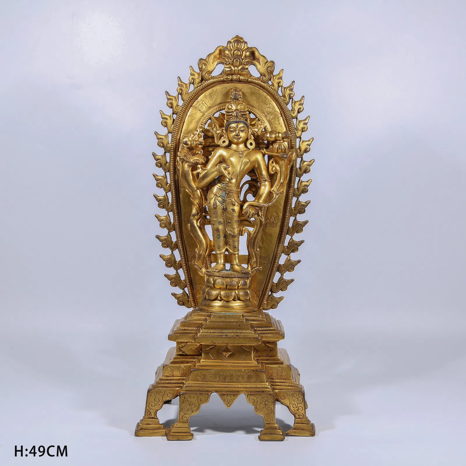 A GILT BRONZE LOTUS-HAND AVALOKITESHVARA STANDING STATUE