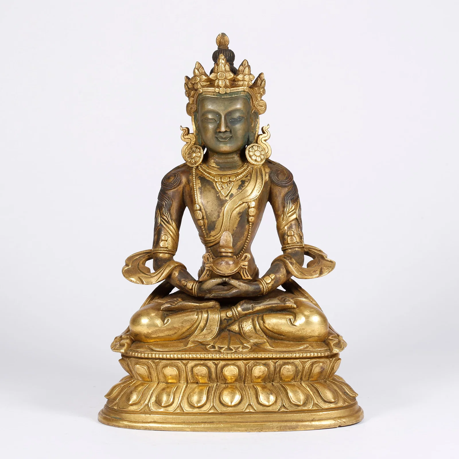 A GILT BRONZE MEDICINE BUDDHA STATUE