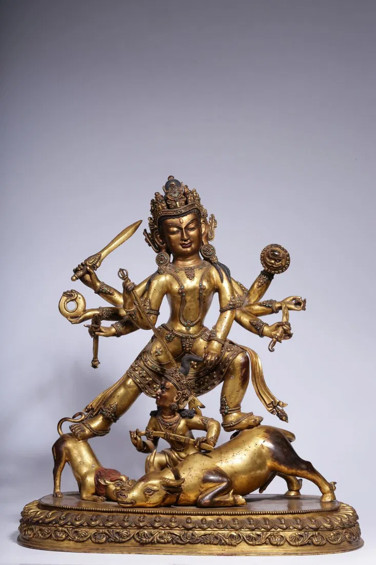 A Gilt Bronze Nanjinmu Statue