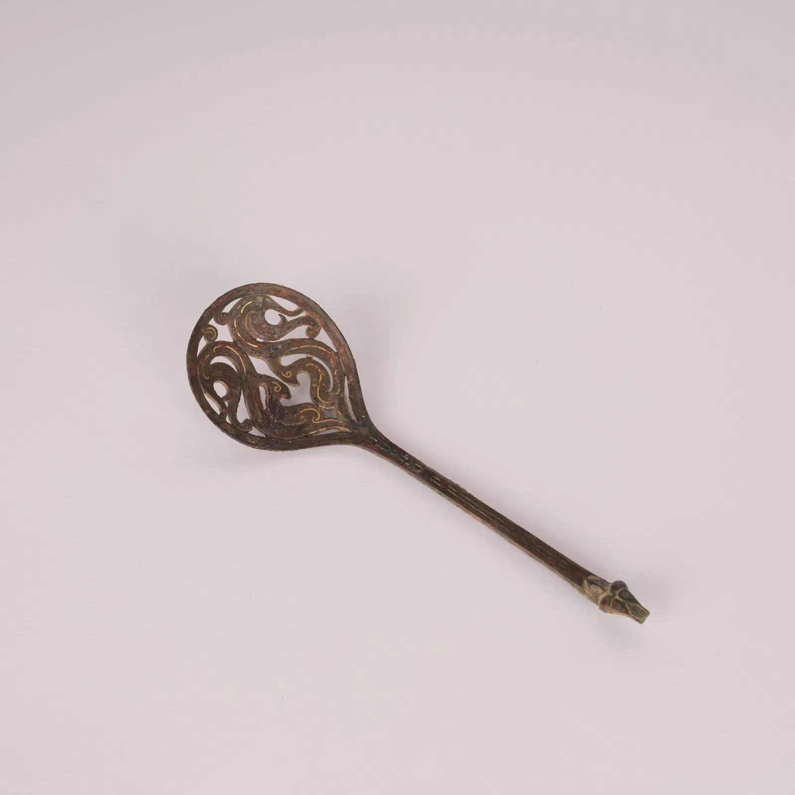 A GILT-BRONZE OPENWORK SPOON, WARRING STATES PERIOD