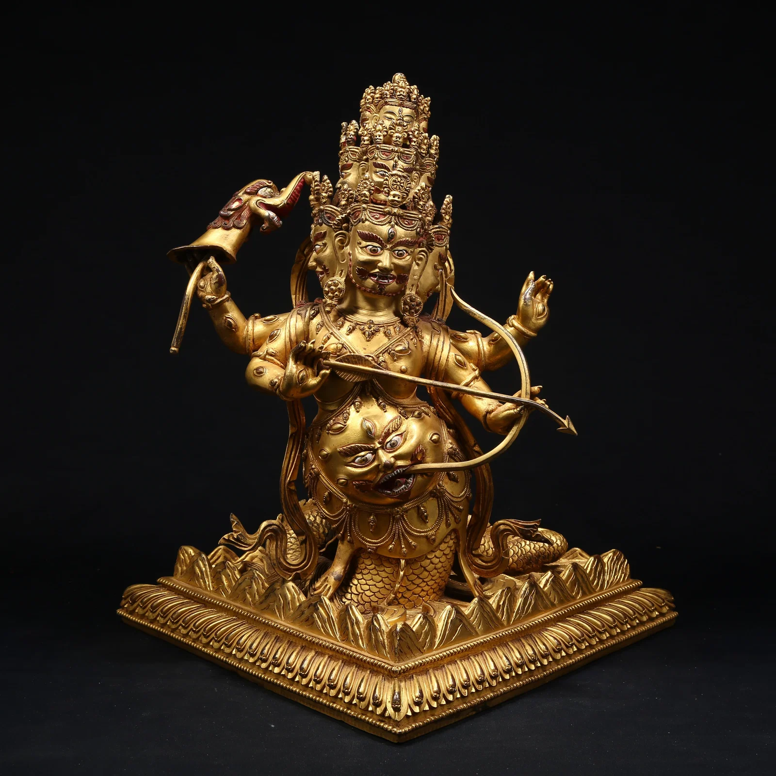 A GILT BRONZE RAHULA PROTECTOR DEITY STATUE