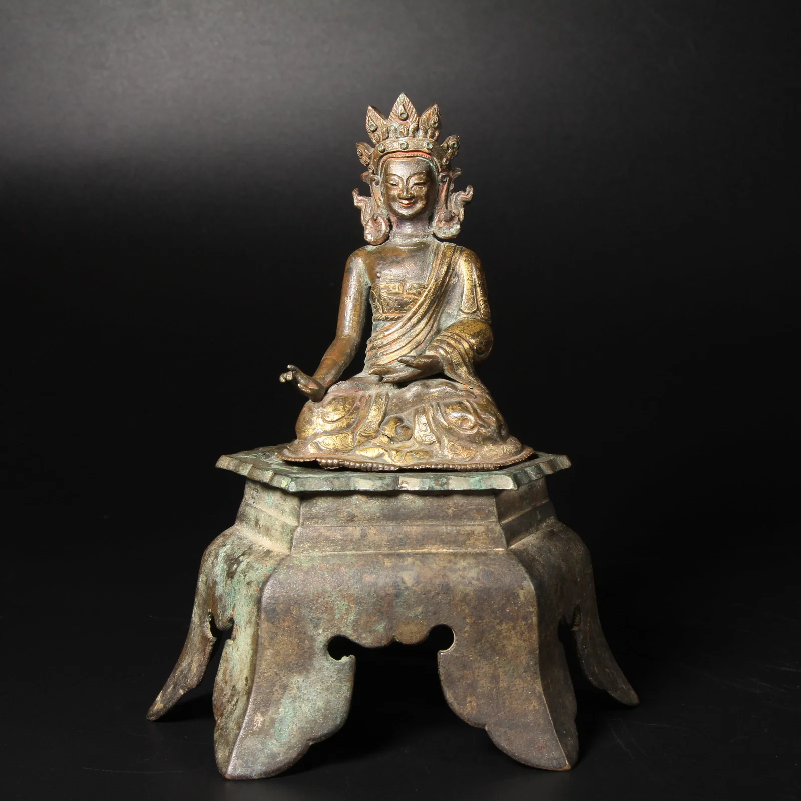 A GILT BRONZE SEATED BODHISATTVA