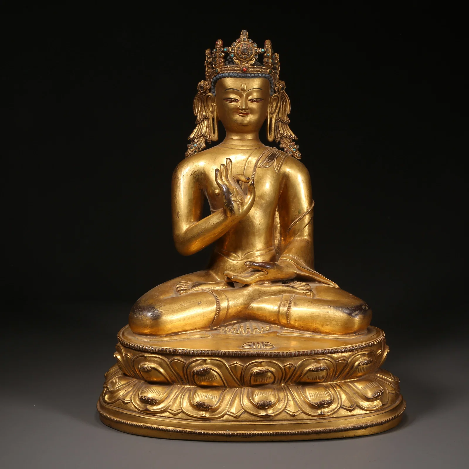 A GILT-BRONZE SHAKYAMUNI BUDDHA PREACHING STATUE