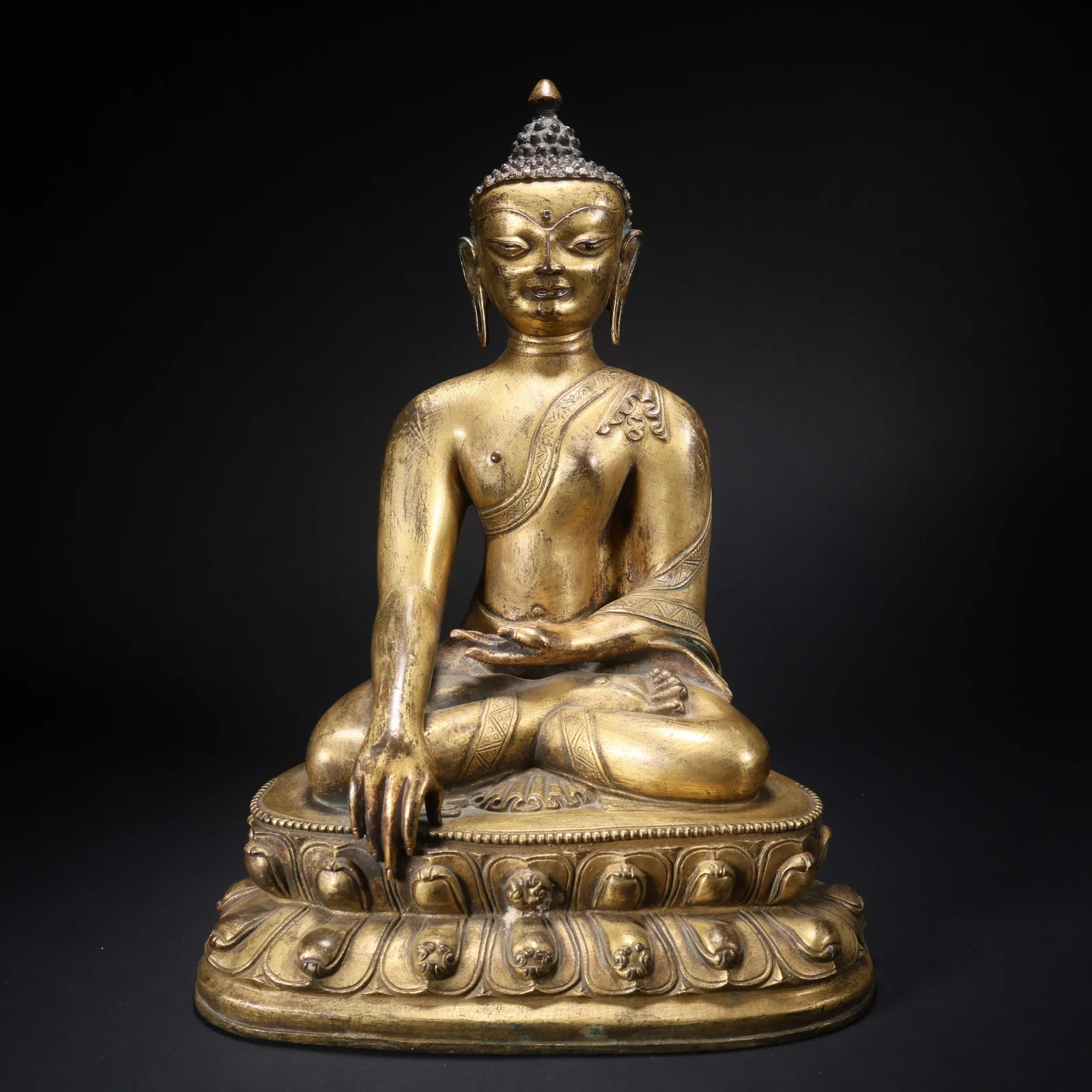 A GILT BRONZE SHAKYAMUNI