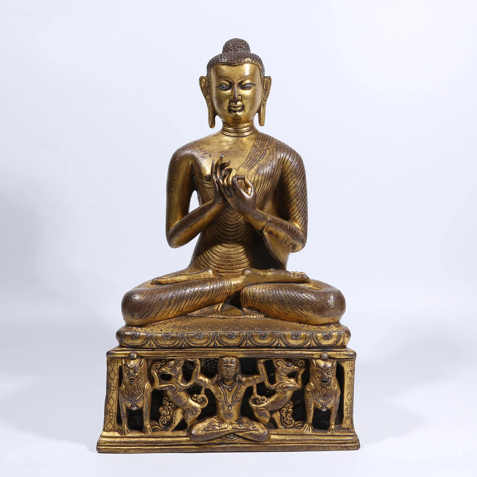 A GILT BRONZE SILVER-INLAID SHAKYAMUNI PREACHING STATUE