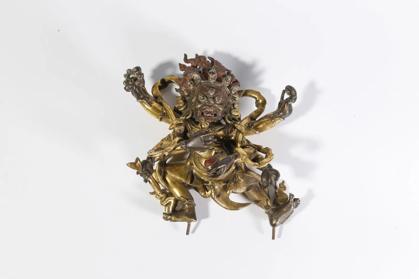 A GILT-BRONZE SIX-ARMED MAH?K?LA STATUE