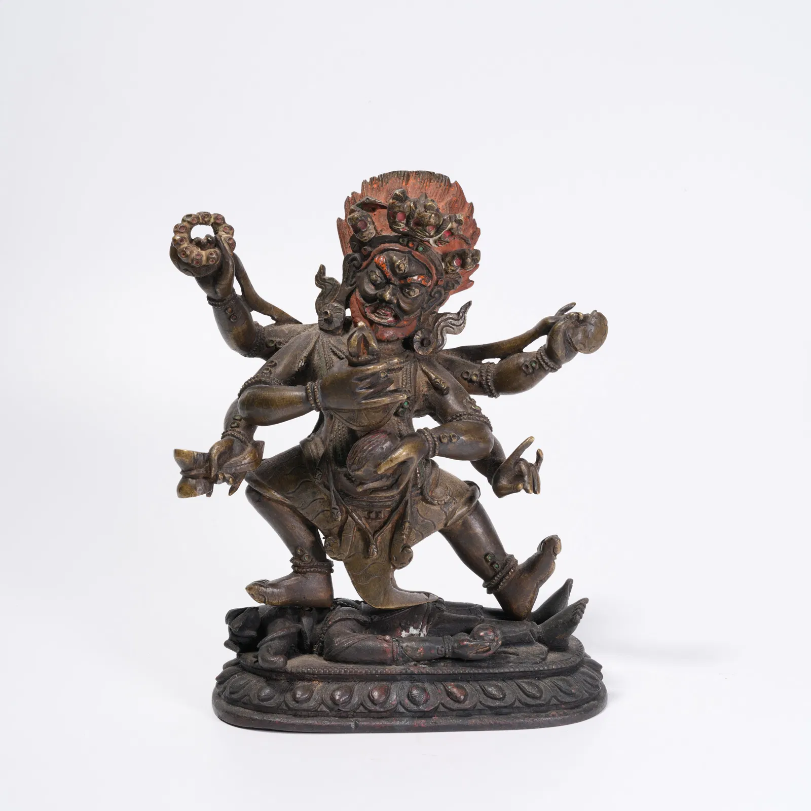 A GILT BRONZE SIX-ARMED MAHAKALA STATUE