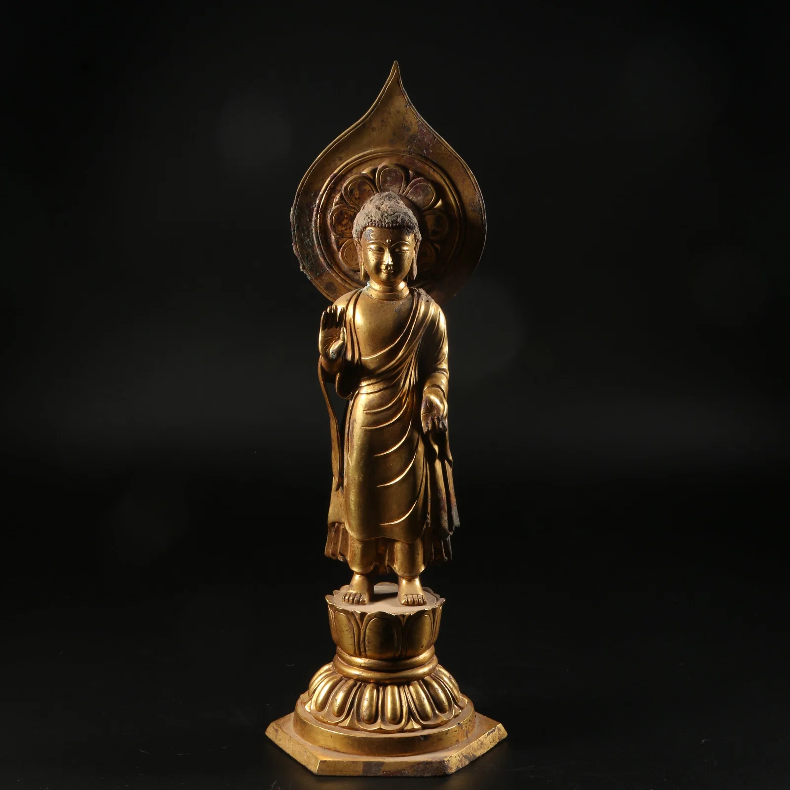 A GILT-BRONZE STANDING SHAKYAMUNI BUDDHA STATUE