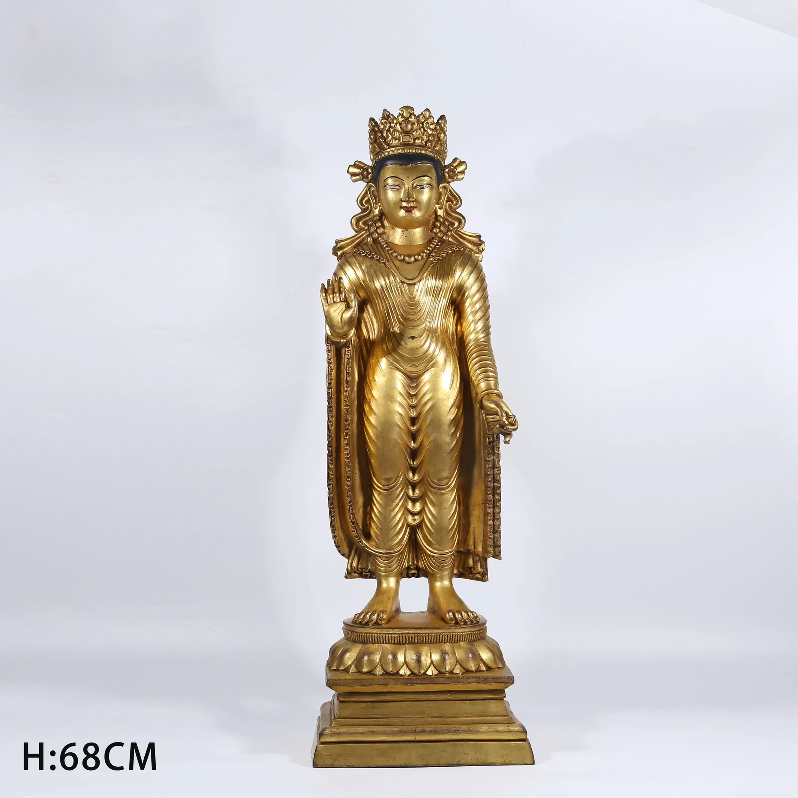 A GILT BRONZE STANDING SHAKYAMUNI STATUE