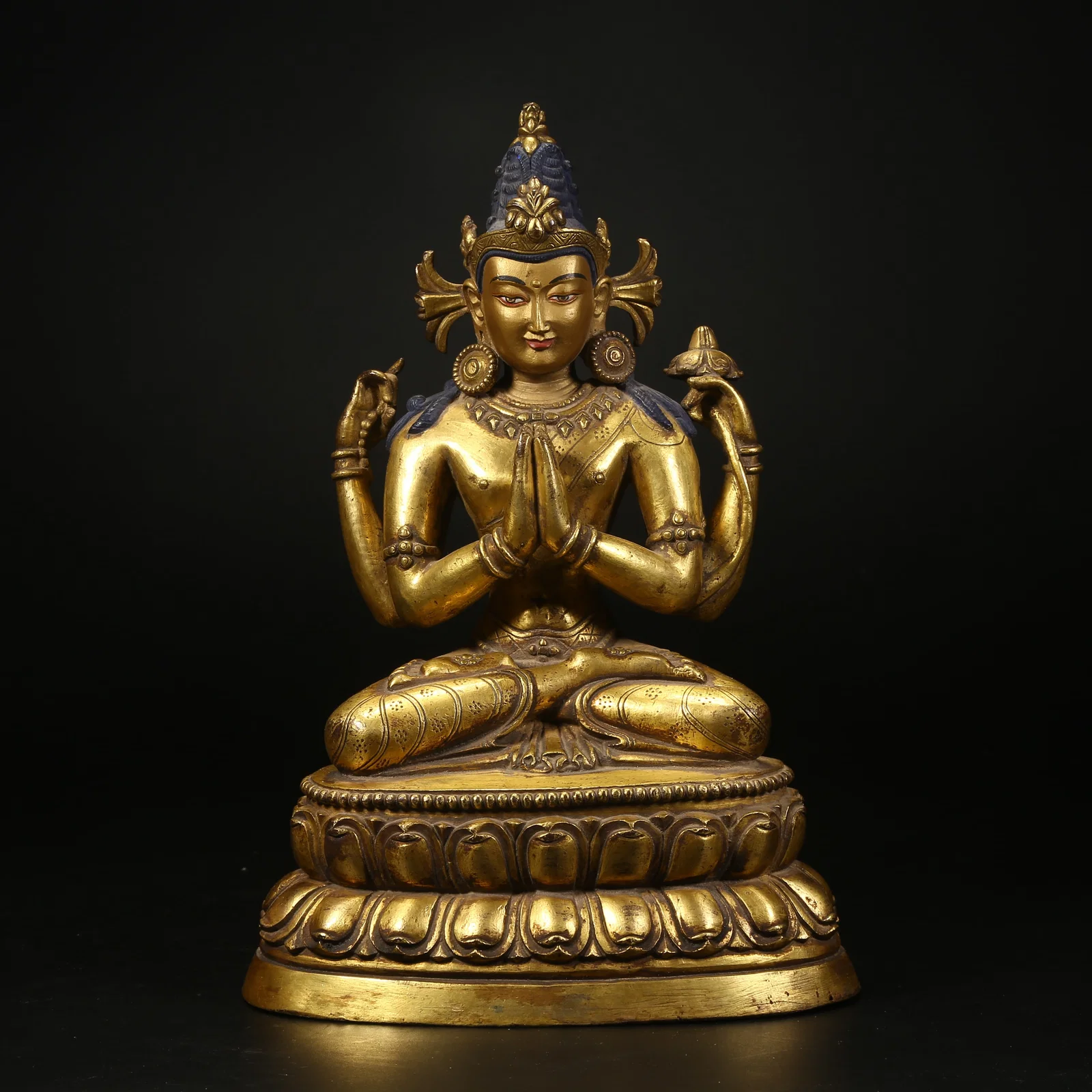 A GILT BRONZE STATUE OF FOUR-ARMED AVALOKITESHVARA