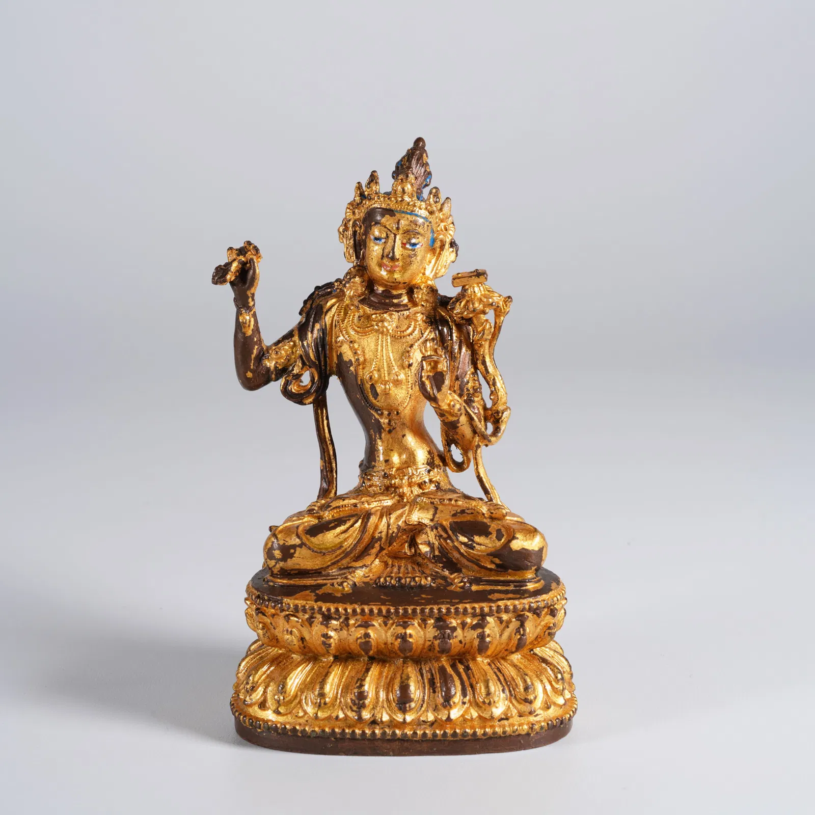 A GILT-BRONZE STATUE OF MANJUSHRI