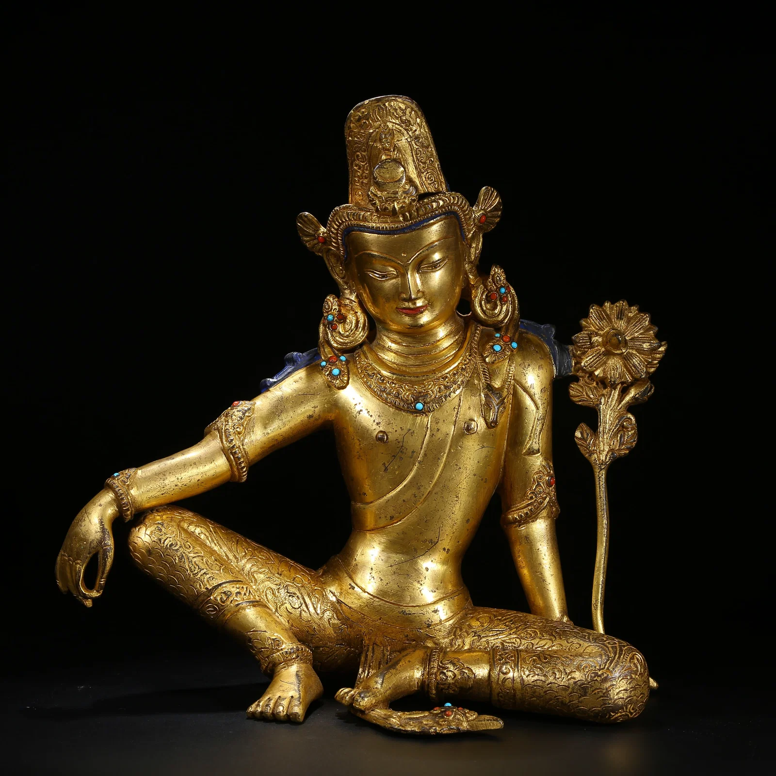 A GILT BRONZE STATUE OF PADMAPANI AVALOKITESHVARA INLAID WITH GEMS