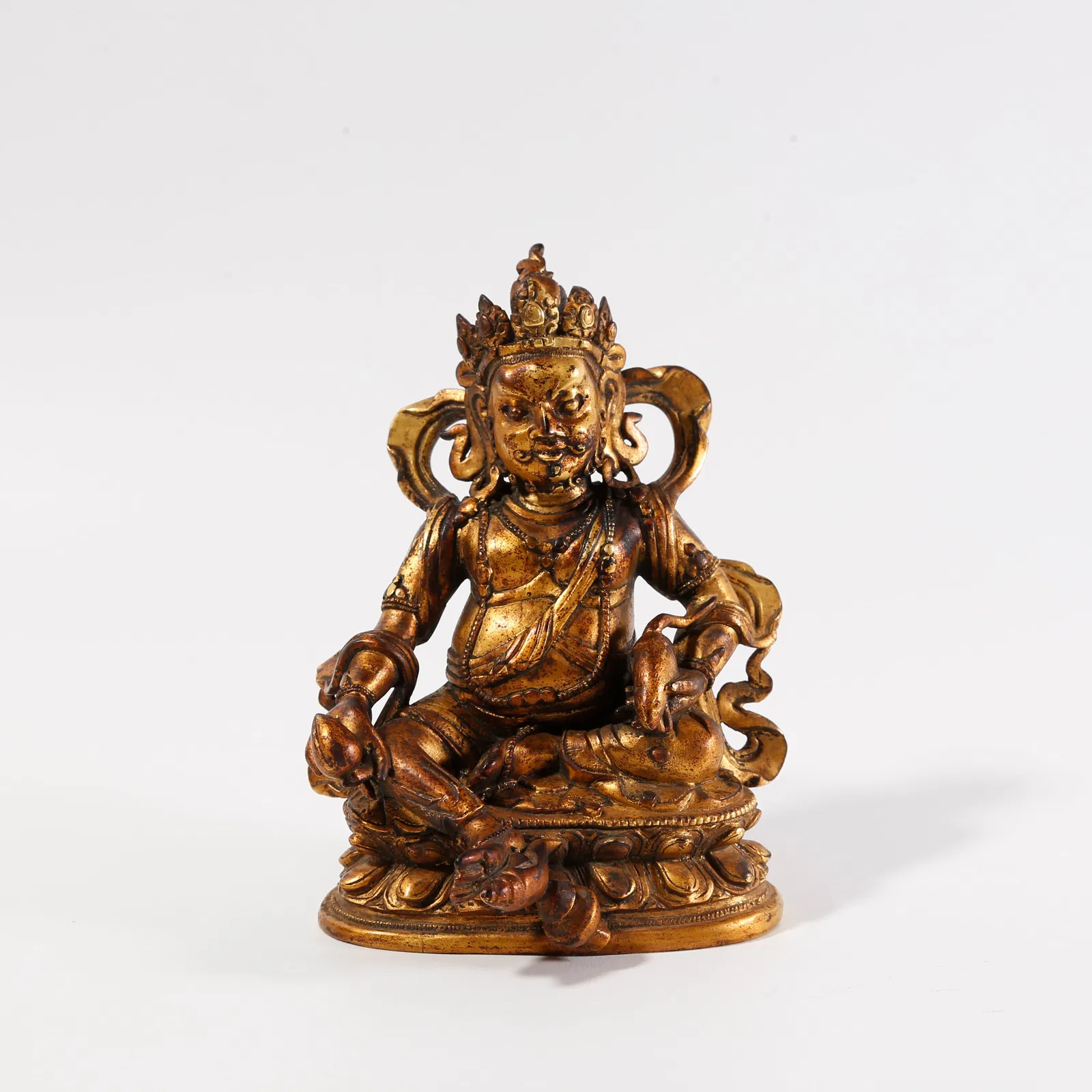 A GILT-BRONZE STATUE OF THE YELLOW GOD OF WEALTH