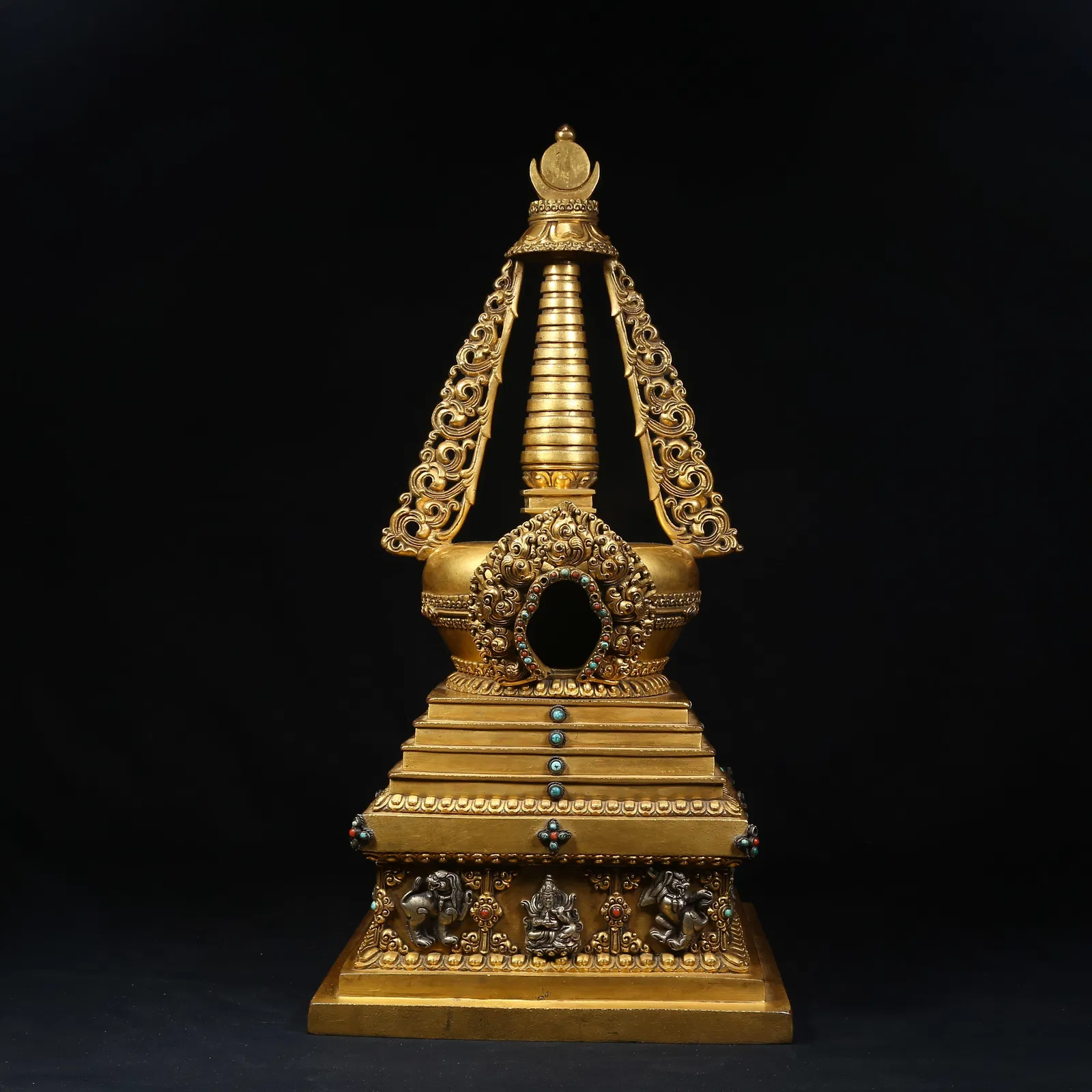 A GILT BRONZE STUPA