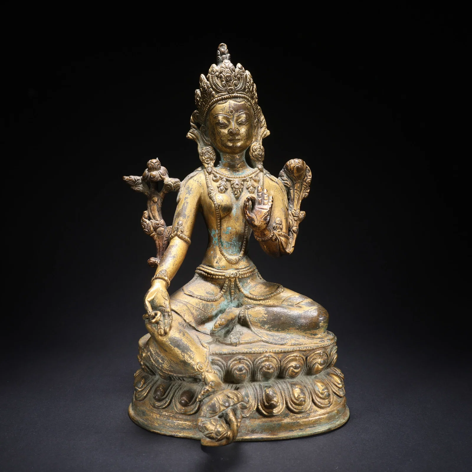 A GILT BRONZE TARA