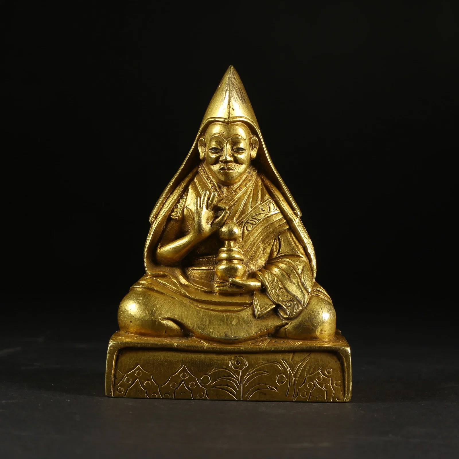 A GILT-BRONZE TEACHER (GURU) STATUE