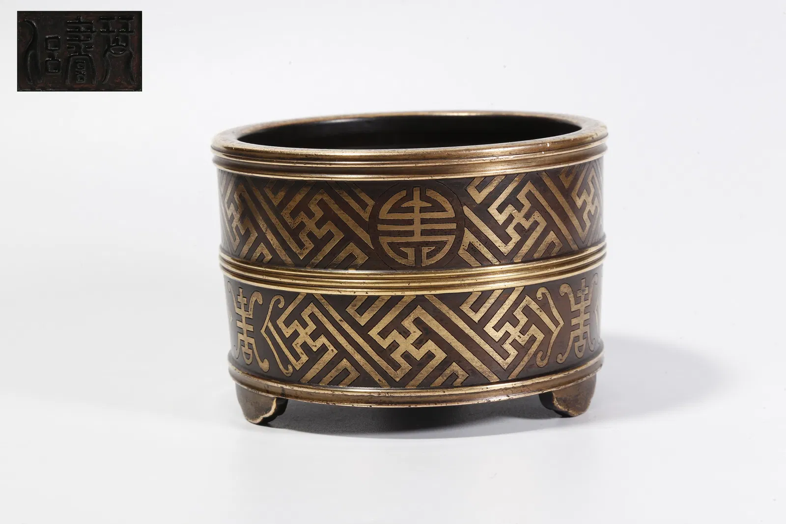 A GILT-BRONZE THREE-LEGGED INCENSE BURNER