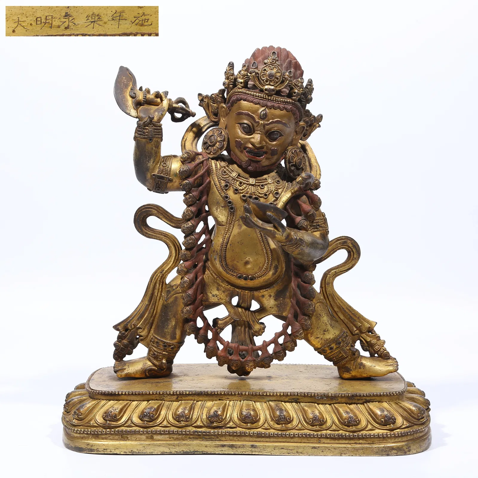 A GILT BRONZE TWO-ARMED MAHAKALA STATUE