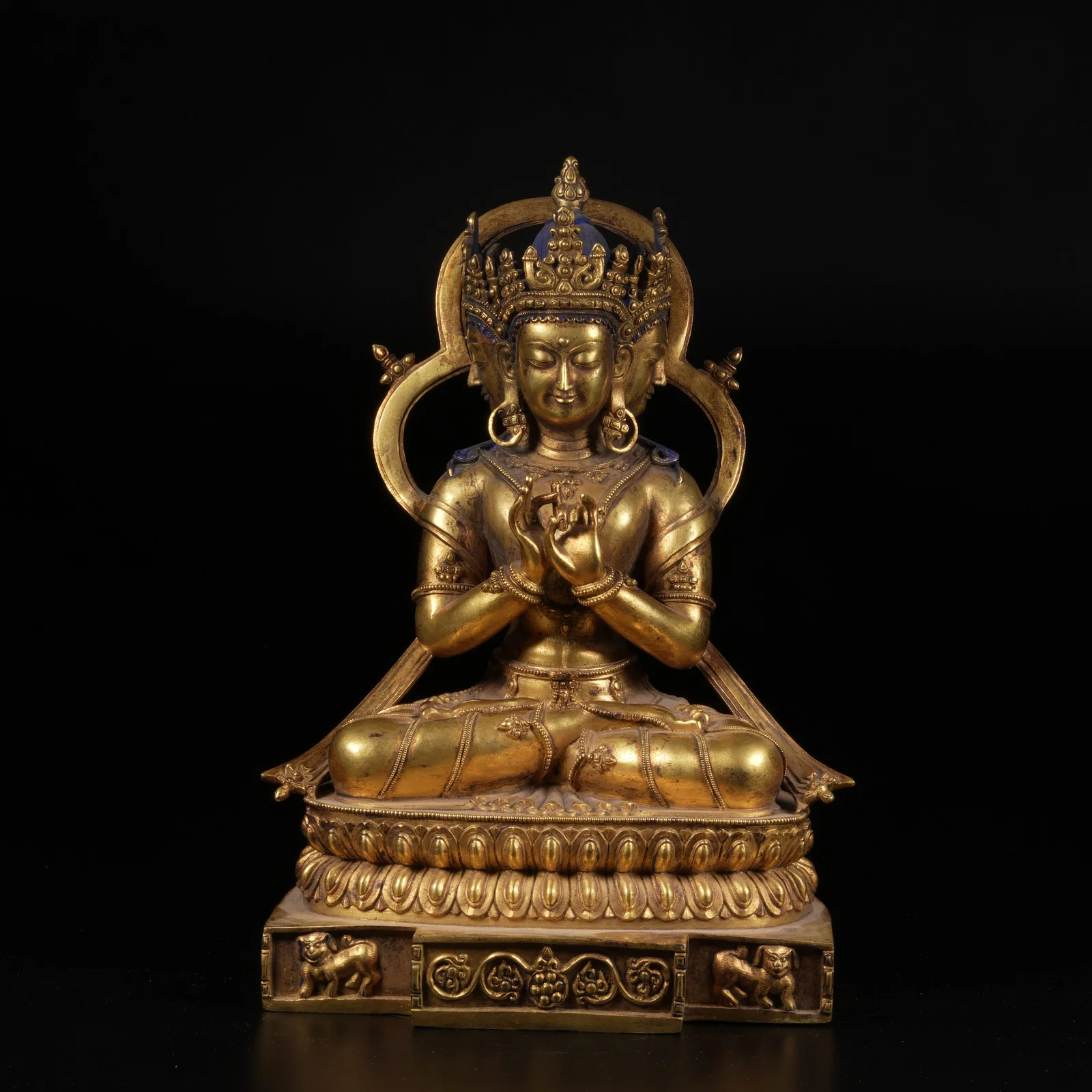 A GILT-BRONZE VAIROCANA BUDDHA STATUE