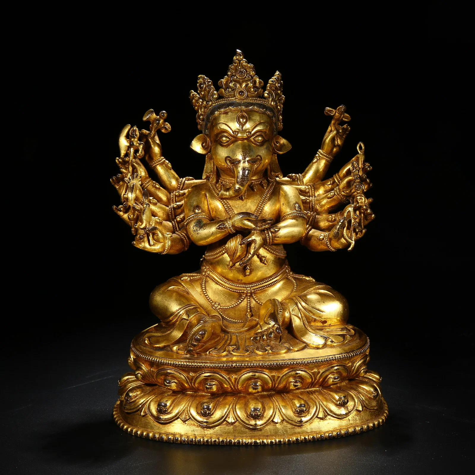 A GILT BRONZE VINAYAKA (GANAPATI) STATUE