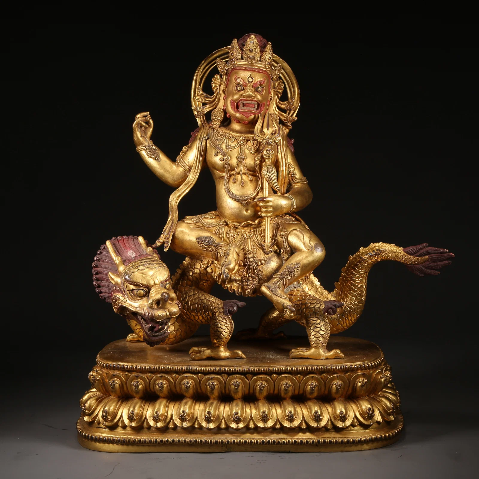 A GILT-BRONZE WATER GOD OF WEALTH STATUE