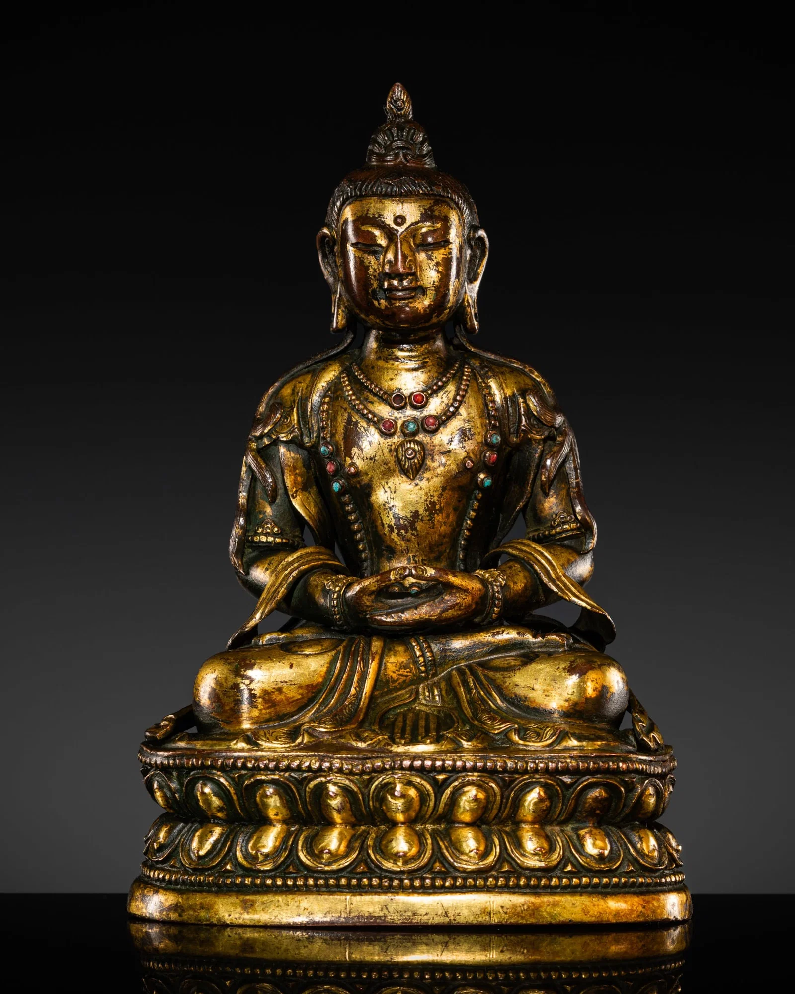A GILT-COPPER ALLOY FIGURE OF BUDDHA AMITAYUS, TIBETAN-CHINESE, 17TH-18TH CENTURY