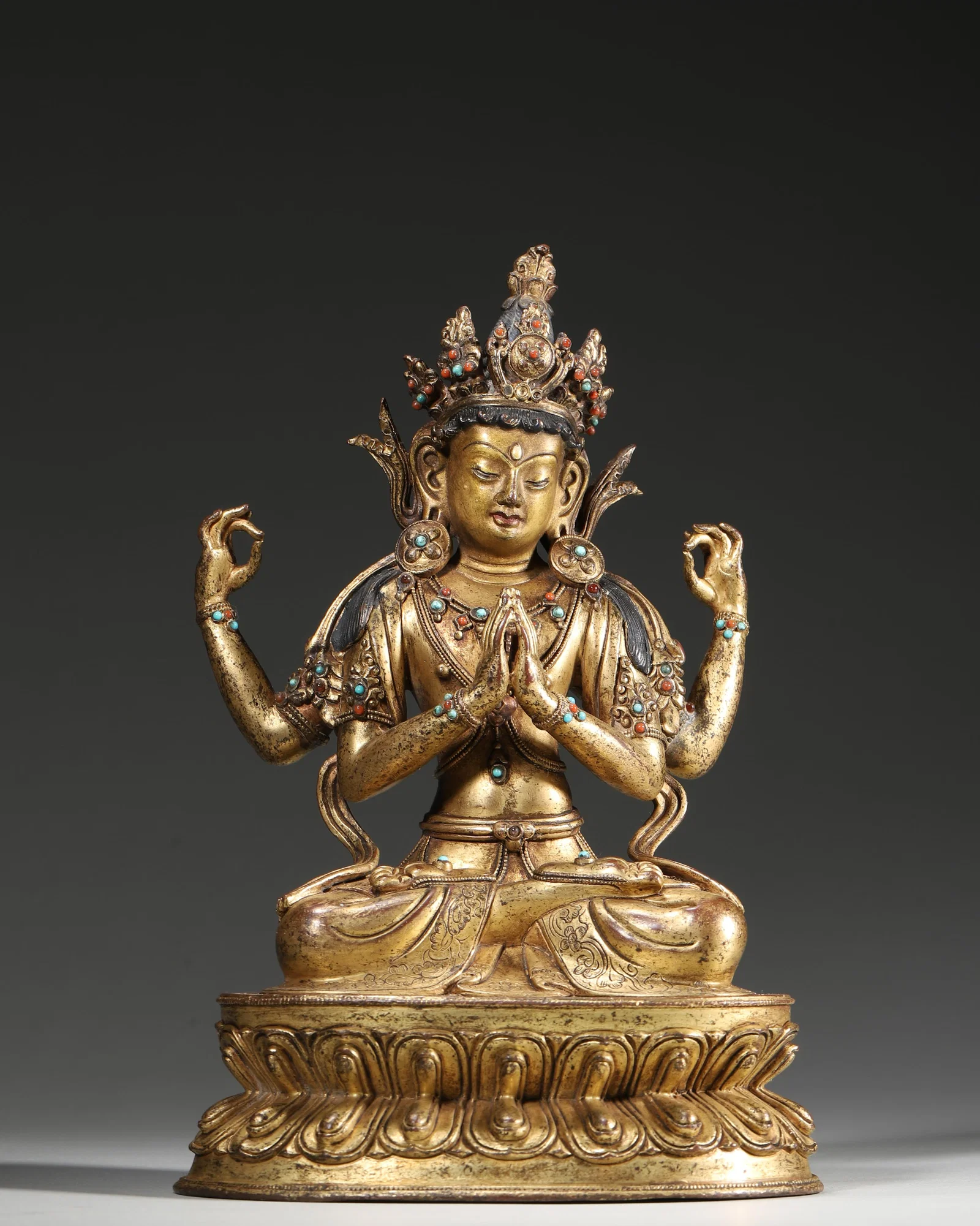 A GILT-COPPER ALLOY FIGURE OF FOUR-ARMED AVALOKITESHVARA WITH INLAID STONES, 17TH–18TH CENTURY