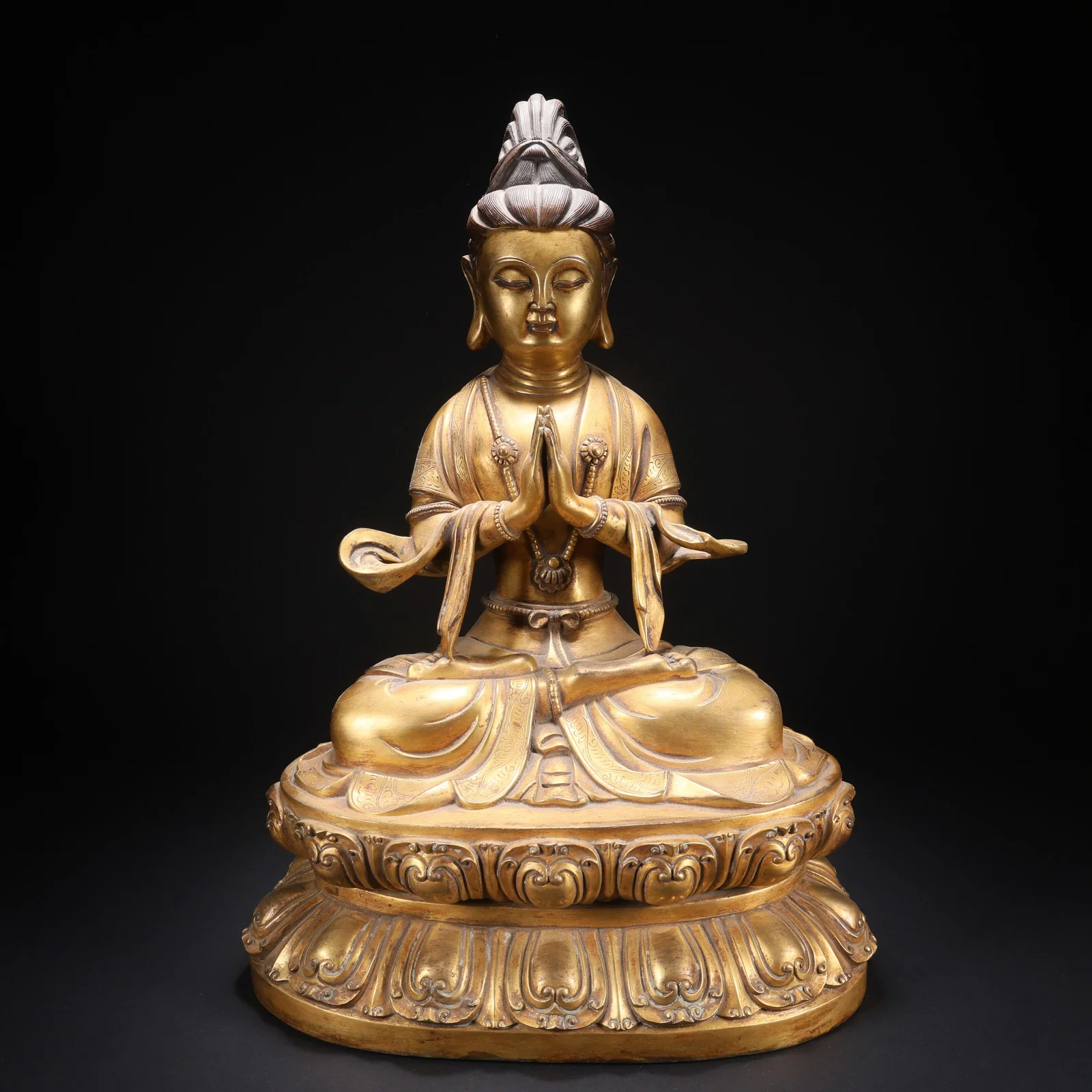 A GILT-COPPER PALMS-JOINED AVALOKITESHVARA FIGURE