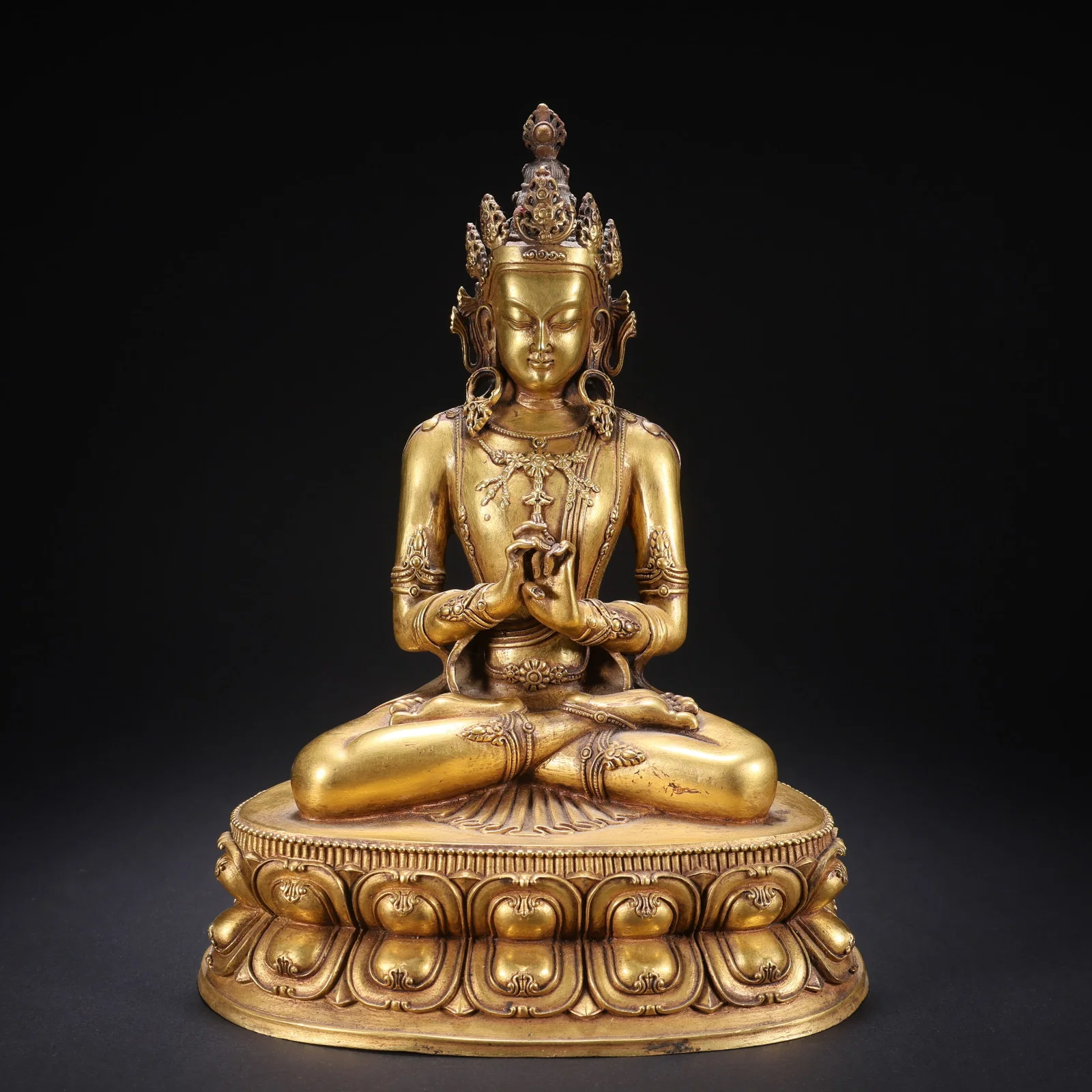 A GILT-COPPER VAJRA SATTRI SEATED FIGURE