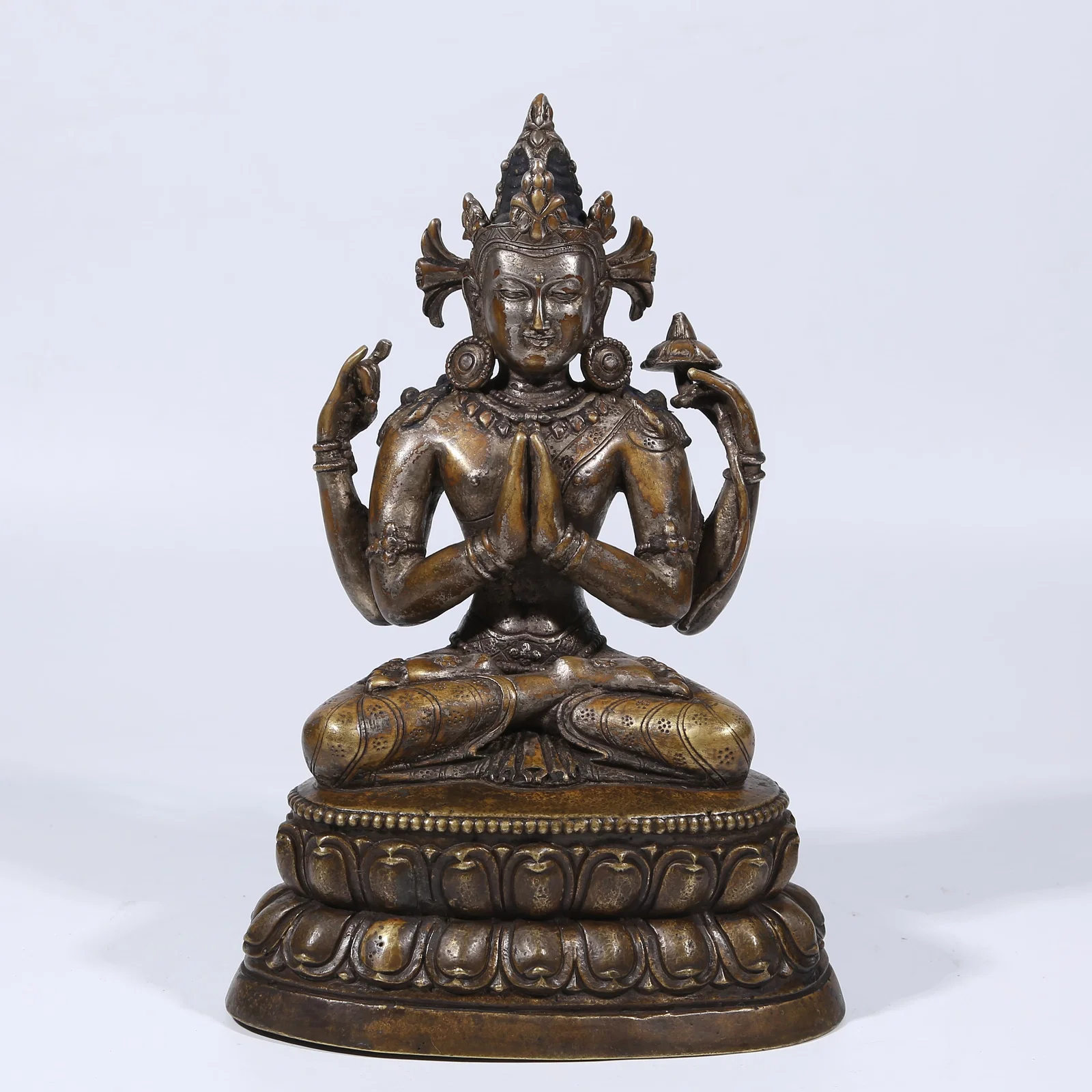 A GILT SILVER FOUR-ARMED AVALOKITESHVARA STATUE