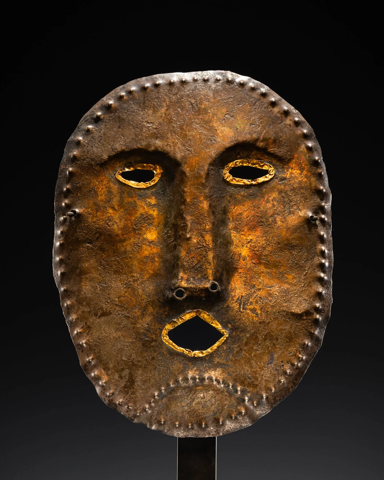 A GOLD-MOUNTED SILVER FUNERARY MASK, UGRIC-MAGYAR, KAMA RIVER BASIN, 9TH-11TH CENTURY