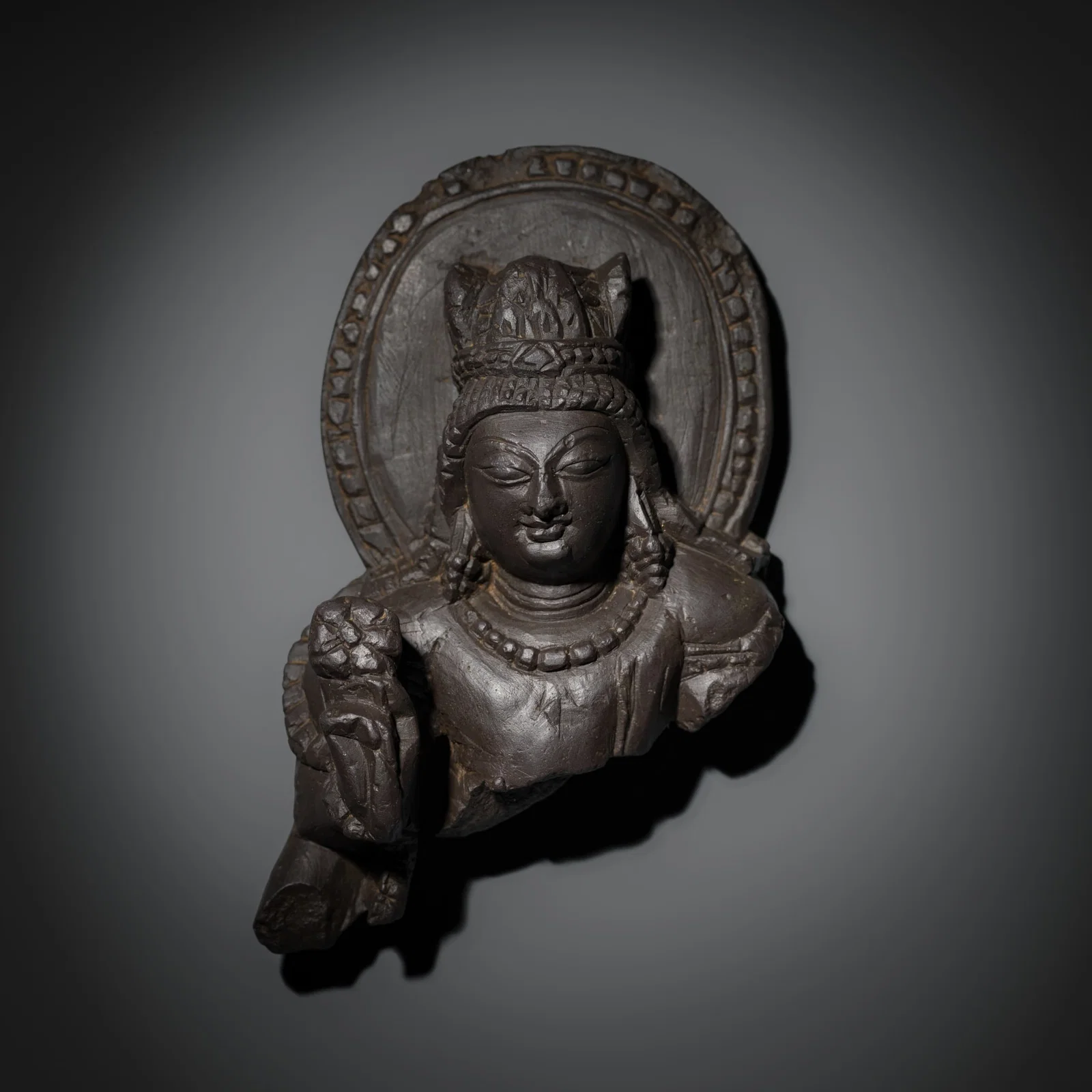 A GRAY SCHIST BUST OF VISHNU, KASHMIR, 8TH-9TH CENTURY