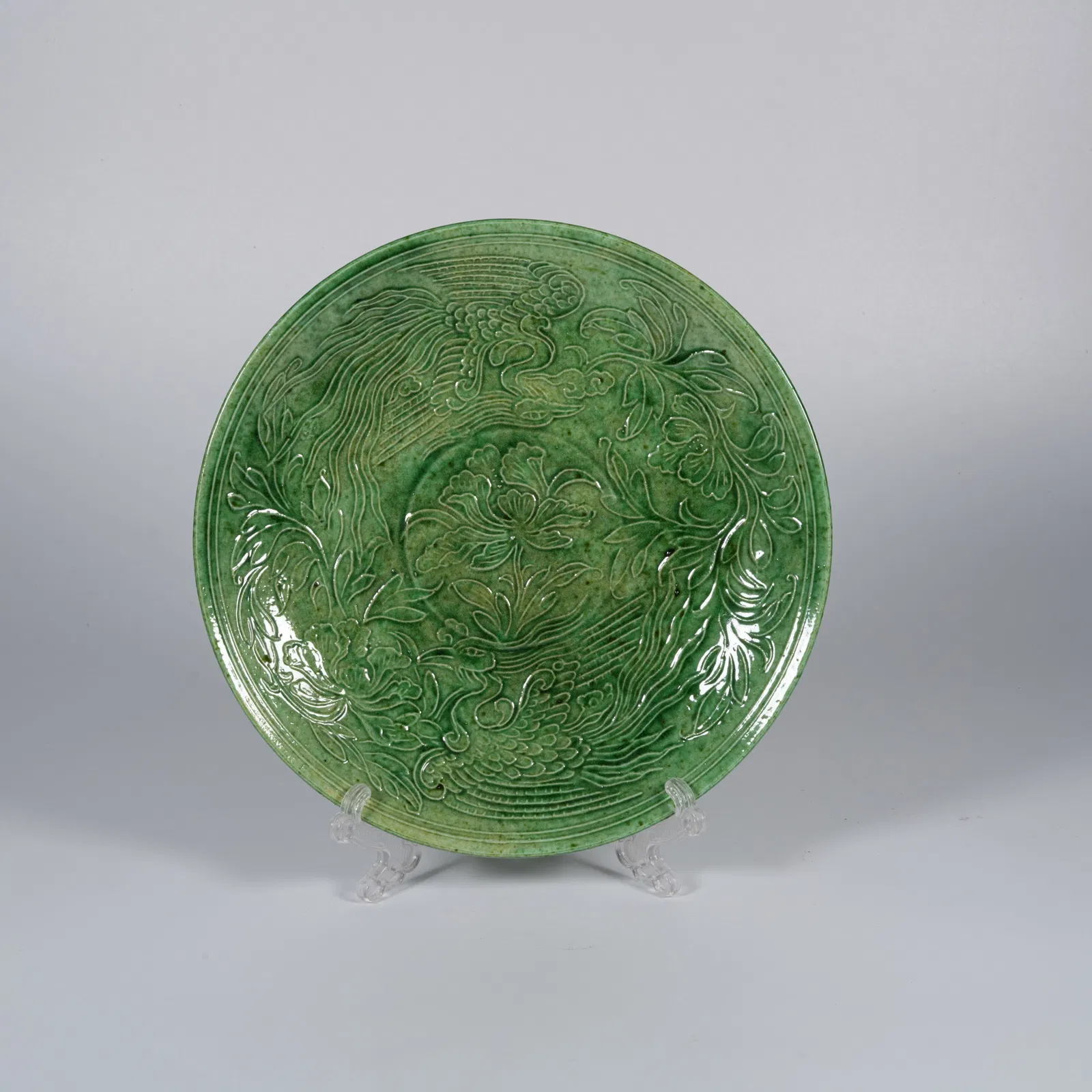 A GREEN-GLAZED DISH WITH PHOENIX MOTIF