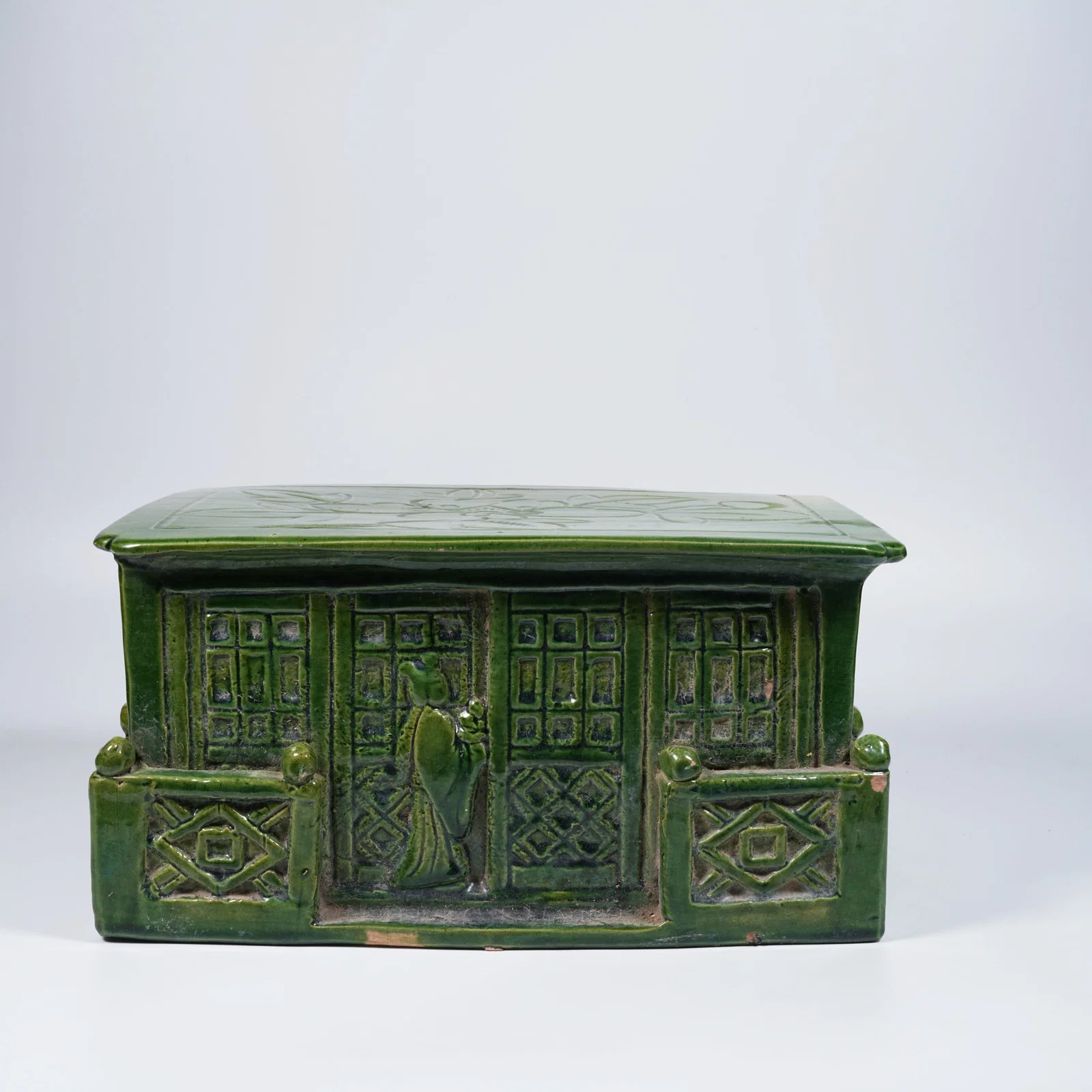 A GREEN-GLAZED PORCELAIN PILLOW
