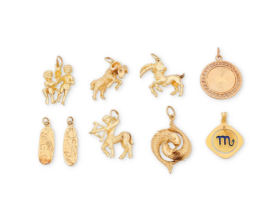 A Group of 14K Gold Zodiac Charms
