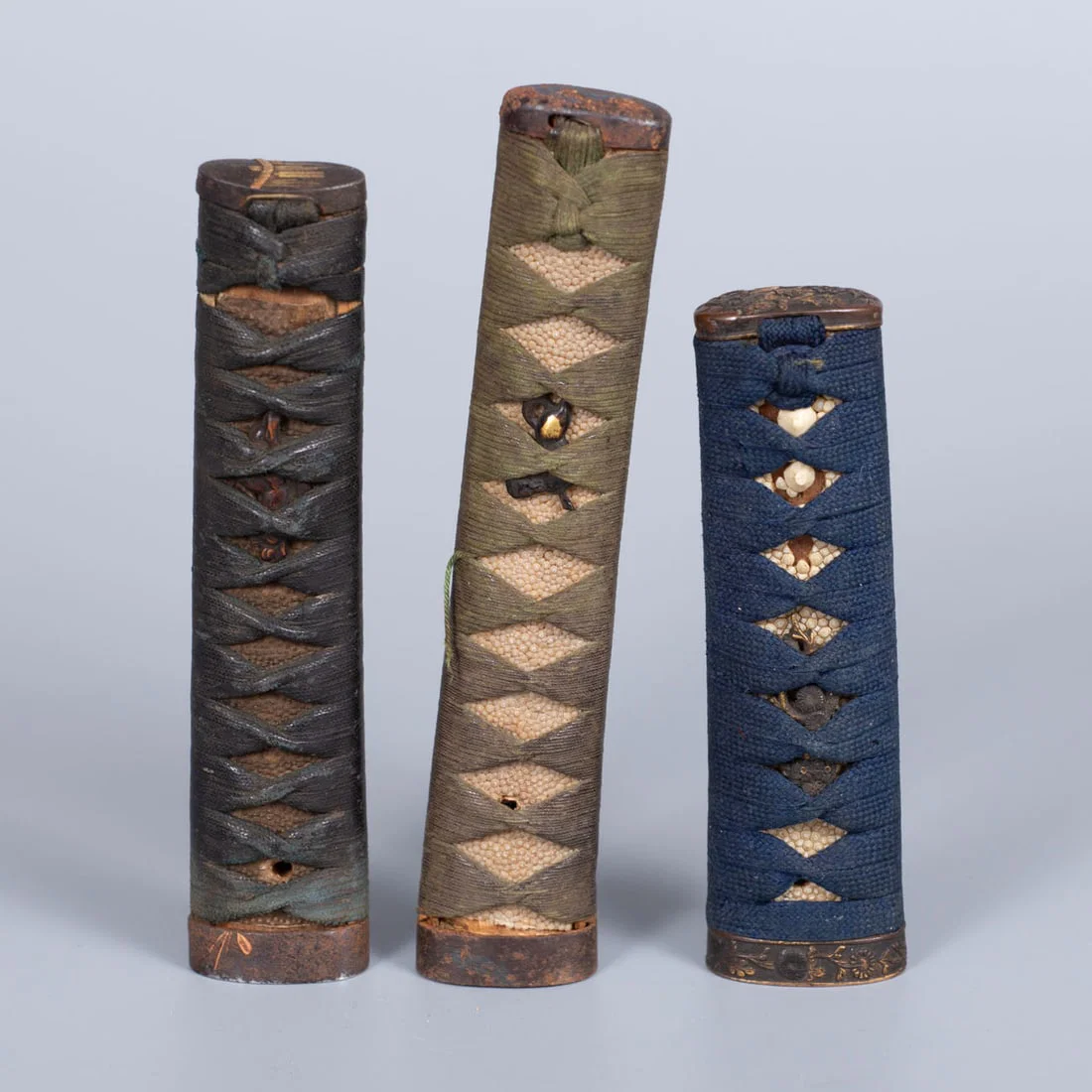 A Group of Three Japanese Katana and Wakizashi Sword Hilts, Late 19th Early 20th Century