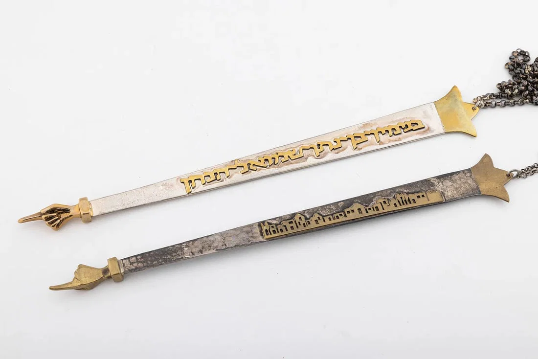 A GROUP OF TWO STERLING SILVER TORAH POINTERS