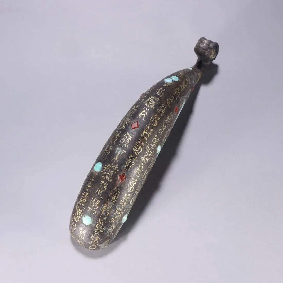 A Han Dynasty Cuo gold and silver inlaid turquoise belt hook