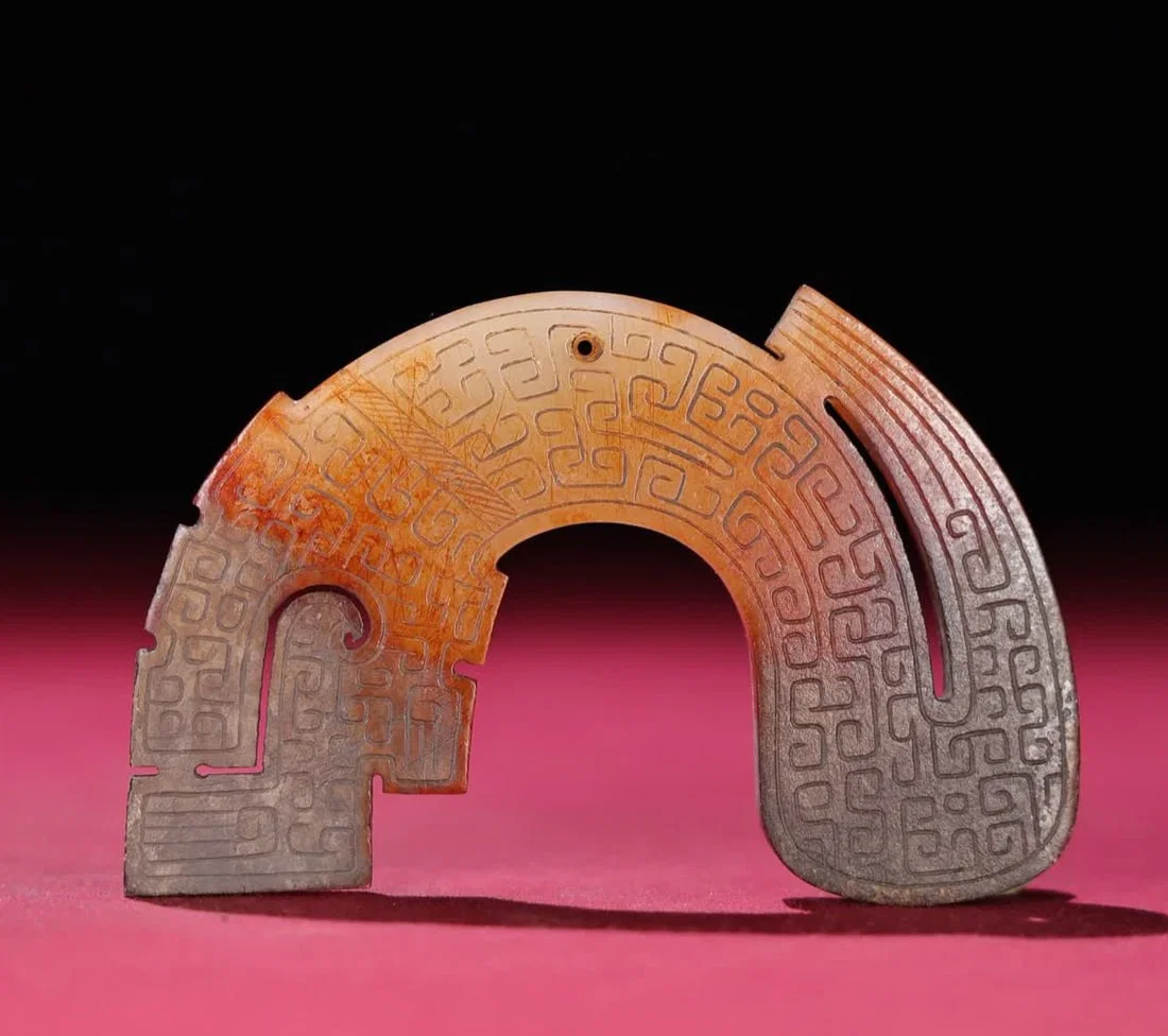 A Han Dynasty white jade Qin dragon pendant