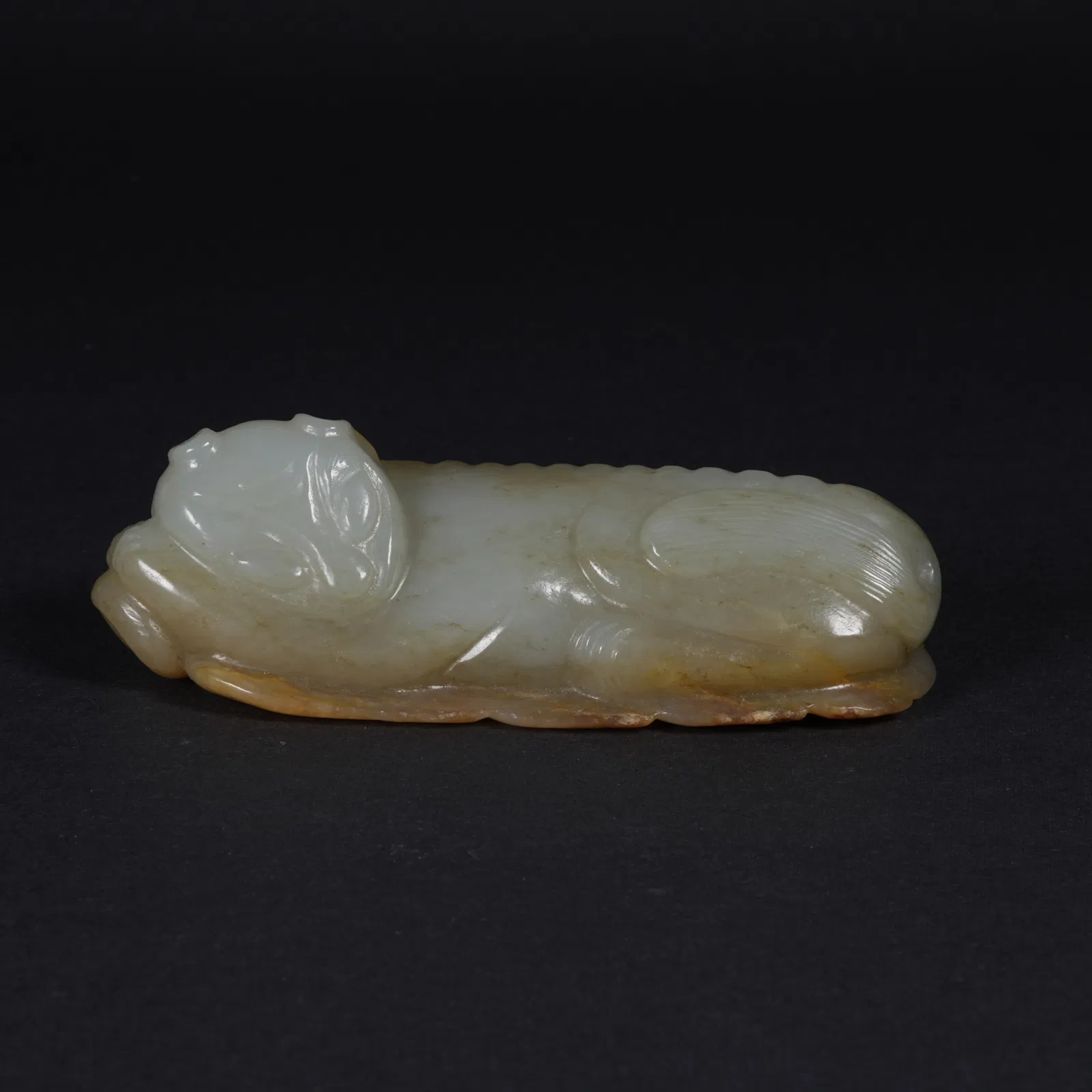A HETIAN JADE AUSPICIOUS BEAST FIGURINE
